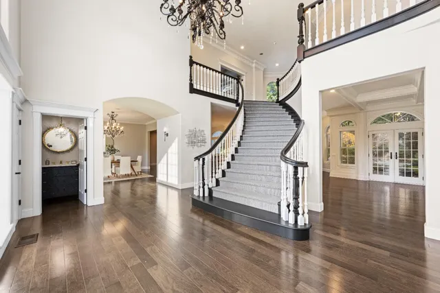 a bathroom with a sink mirror and vanity