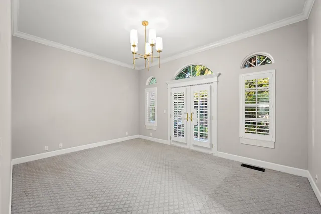 a bathroom with a granite countertop sink toilet mirror and shower