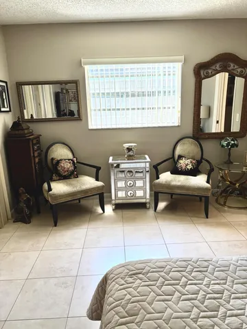 a bedroom with furniture and a window