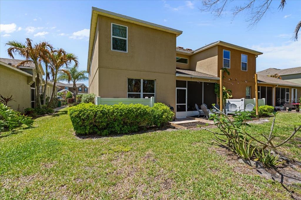 3271 Titanic Circle, Unit 39 Indialantic, FL 32903 - Photo 43 of 60 a front view of a house with a yard