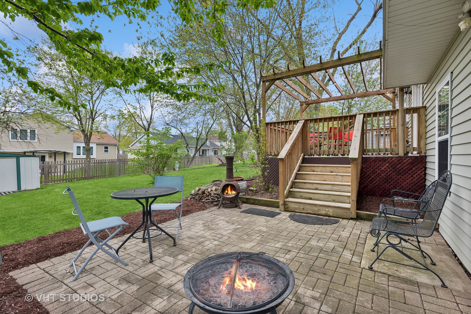 27W252 Churchill Road Winfield, IL 60190 - Photo 13 of 18 a backyard of a house with barbeque oven table and chairs
