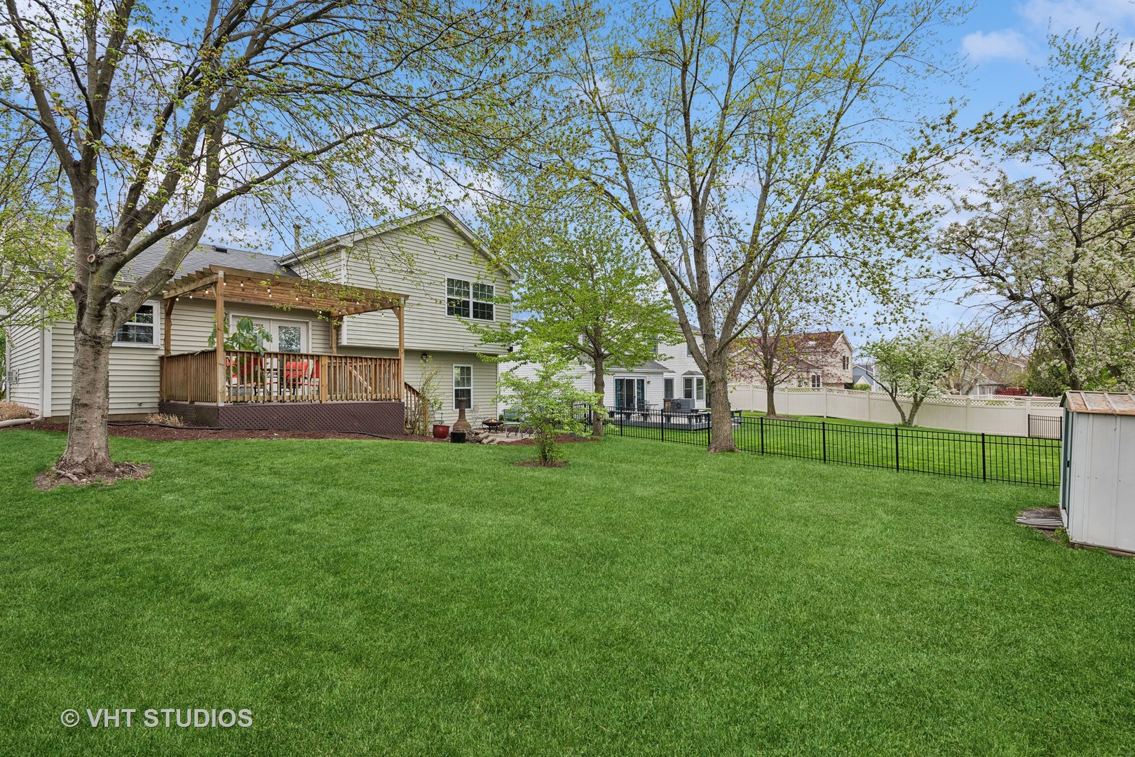 27W252 Churchill Road Winfield, IL 60190 - Photo 14 of 18 a view of a yard with a house in the background
