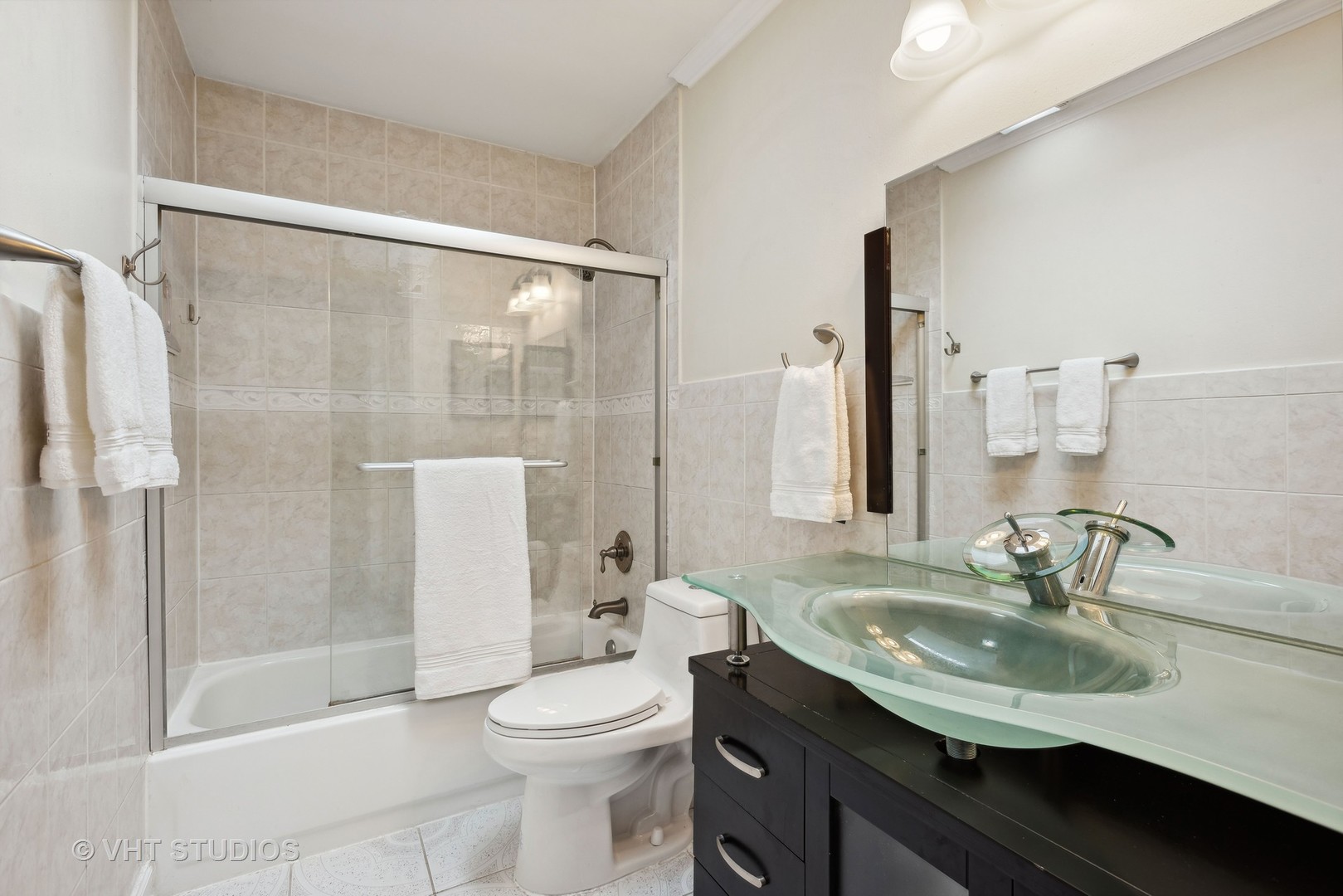27W252 Churchill Road Winfield, IL 60190 - Photo 6 of 18 a bathroom with a sink toilet and shower