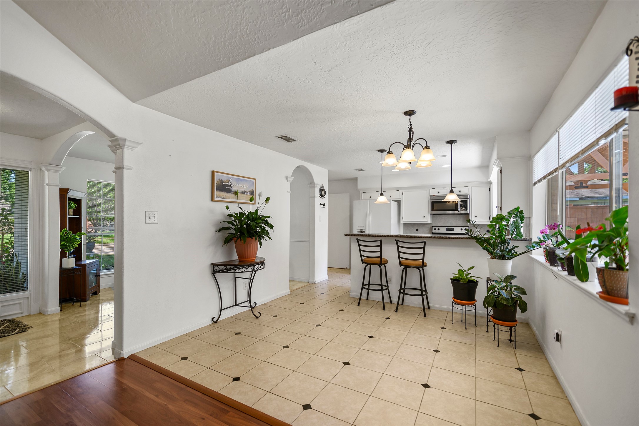6815 River Mill Drive Spring, TX 77379 - Photo 11 of 33 a view of a dining room with furniture and a chandelier