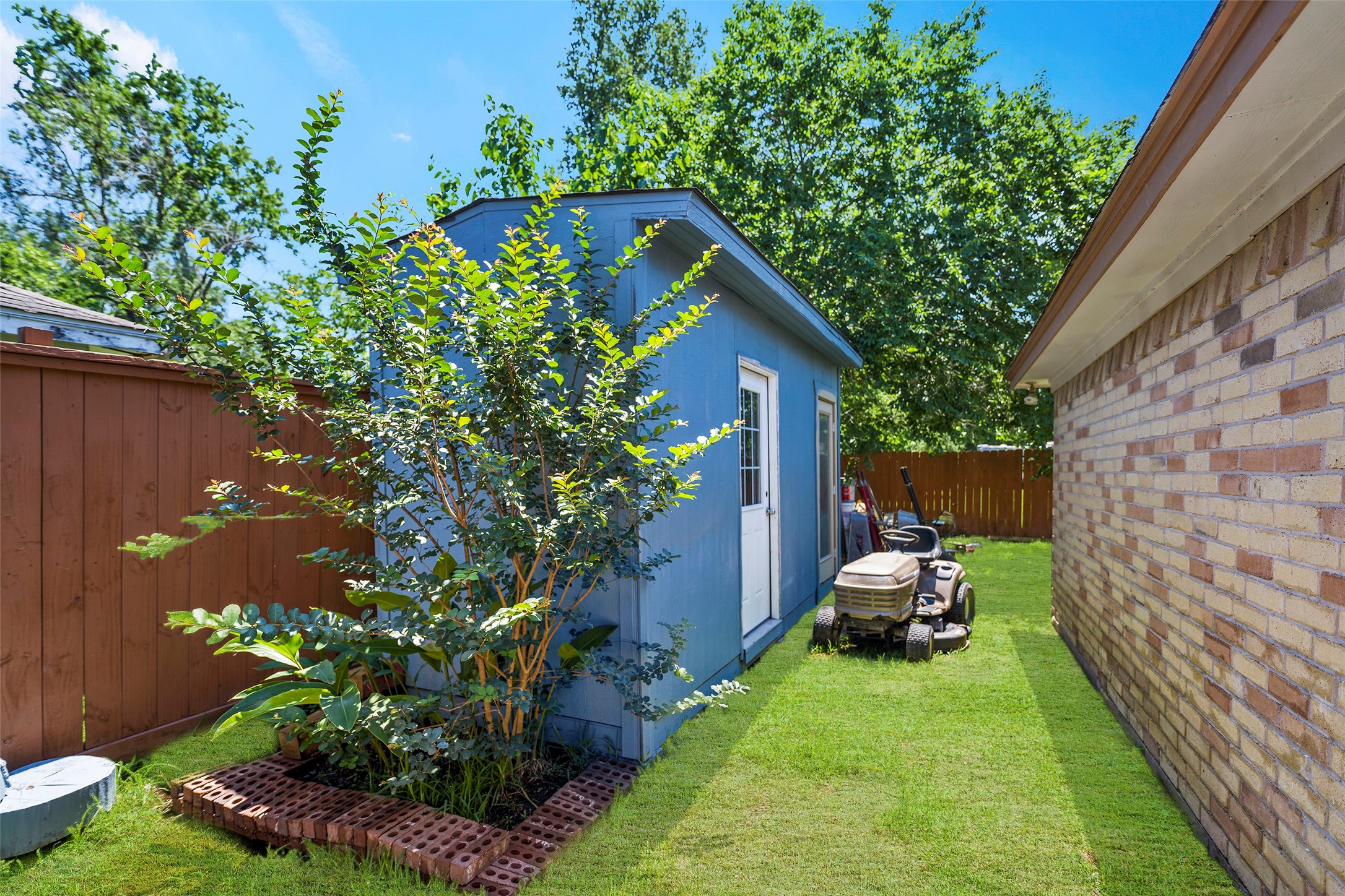 6815 River Mill Drive Spring, TX 77379 - Photo 20 of 33 a view of house with backyard space and garden