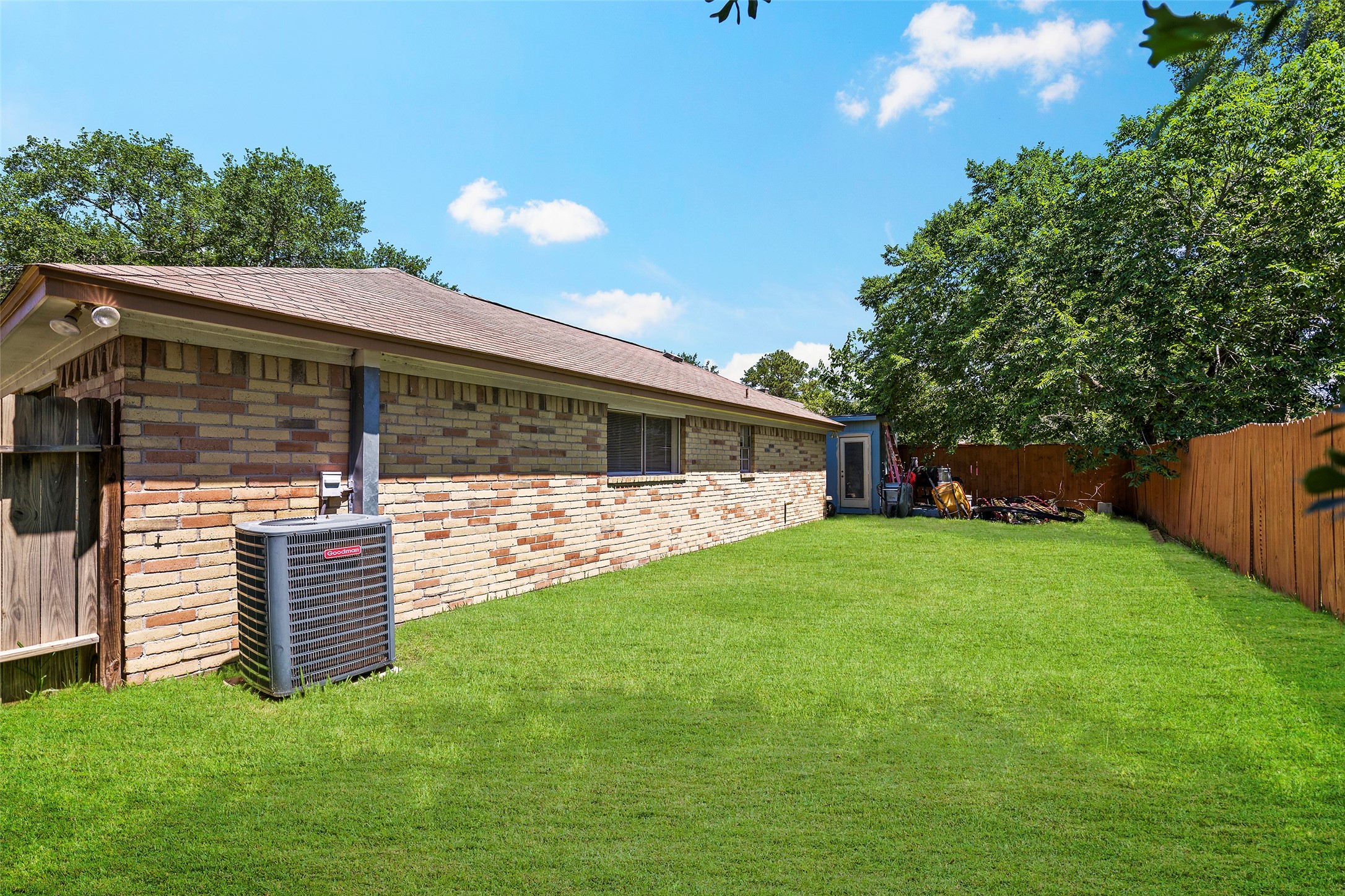 6815 River Mill Drive Spring, TX 77379 - Photo 21 of 33 a front view of a house with a garden