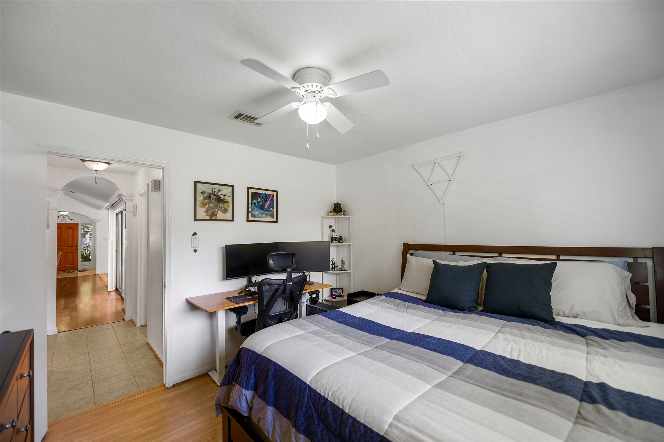 6815 River Mill Drive Spring, TX 77379 - Photo 28 of 33 a bedroom with a bed and wooden floor