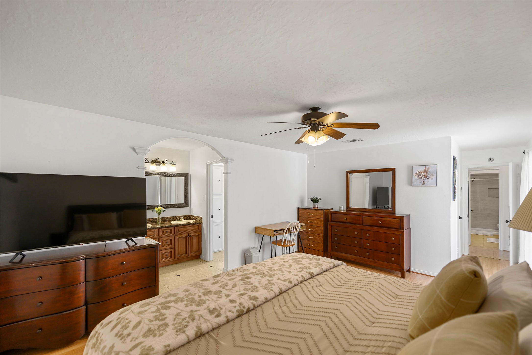 6815 River Mill Drive Spring, TX 77379 - Photo 30 of 33 a bedroom with a bed and wooden floor