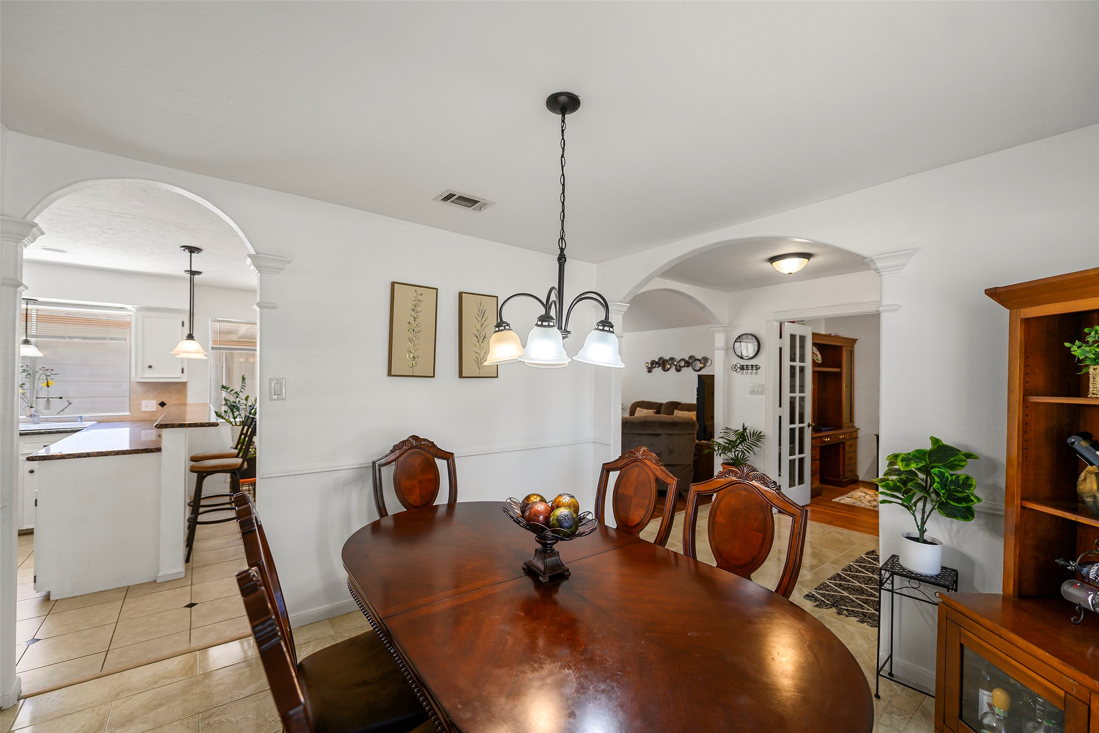 6815 River Mill Drive Spring, TX 77379 - Photo 6 of 33 a dining room with furniture and wooden floor
