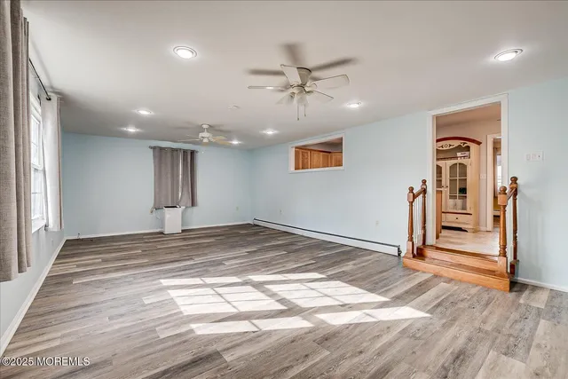 a view of a livingroom with wooden floor
