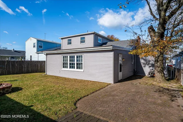 a view of a backyard of the house