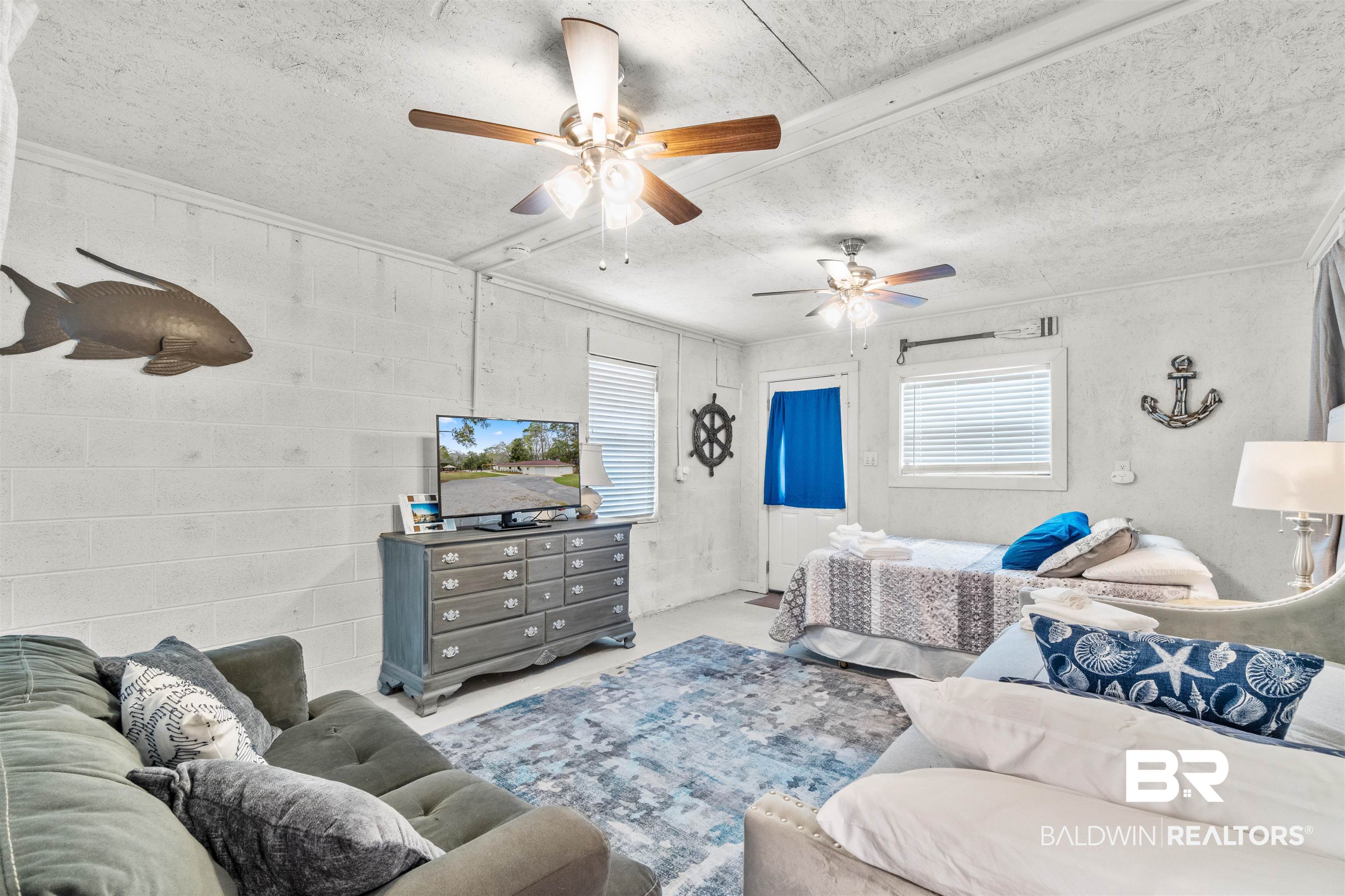17595 River Road Summerdale, AL 36580 - Photo 18 of 29 Bedroom featuring a textured ceiling and a ceiling fan