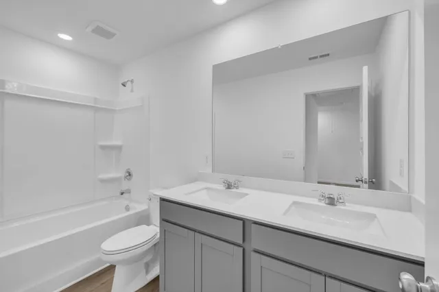 a view of an empty room and a sink