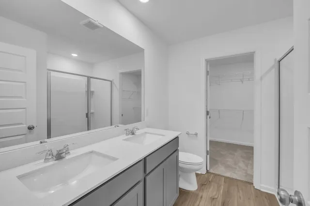 a bathroom with a shower and a sink