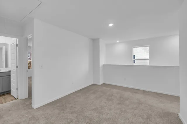 an empty room with closet area