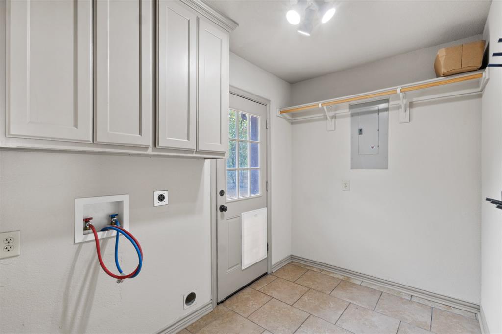 1004 North Cates Street Decatur, TX 76234 - Photo 11 of 30 a storage room with cabinets