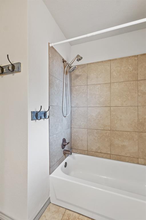1004 North Cates Street Decatur, TX 76234 - Photo 17 of 30 a bathroom with a shower and a bathtub