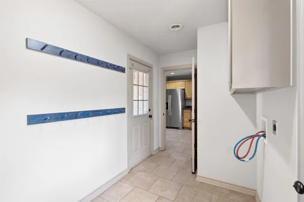 a view of a room with rack and white walls