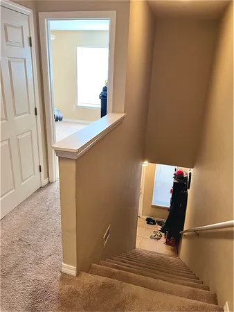 a bathroom with a sink a toilet a mirror and shower