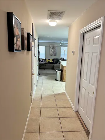 a view of a hallway with seating area