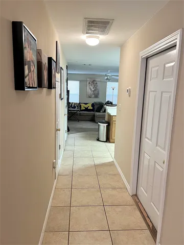 a view of a hallway with seating area