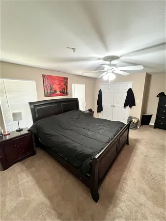 a bedroom with a bed and window