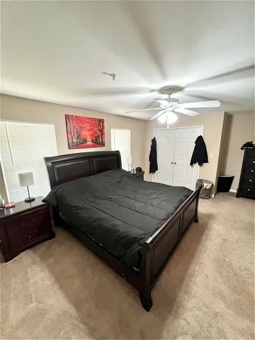 a bedroom with a bed and window