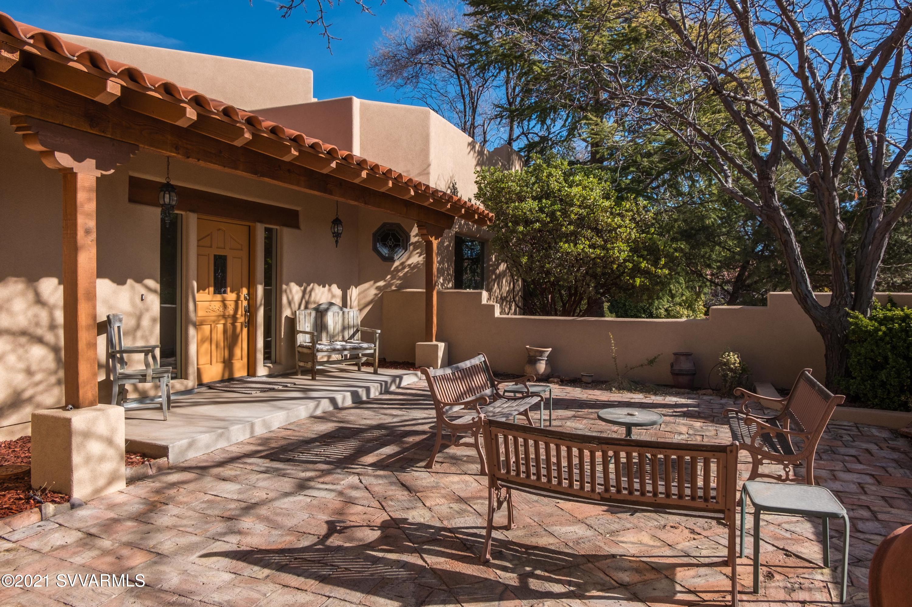 2430 Ranch Road Sedona, AZ 86336 - Photo 3 of 58 a view of a chairs and table in the patio
