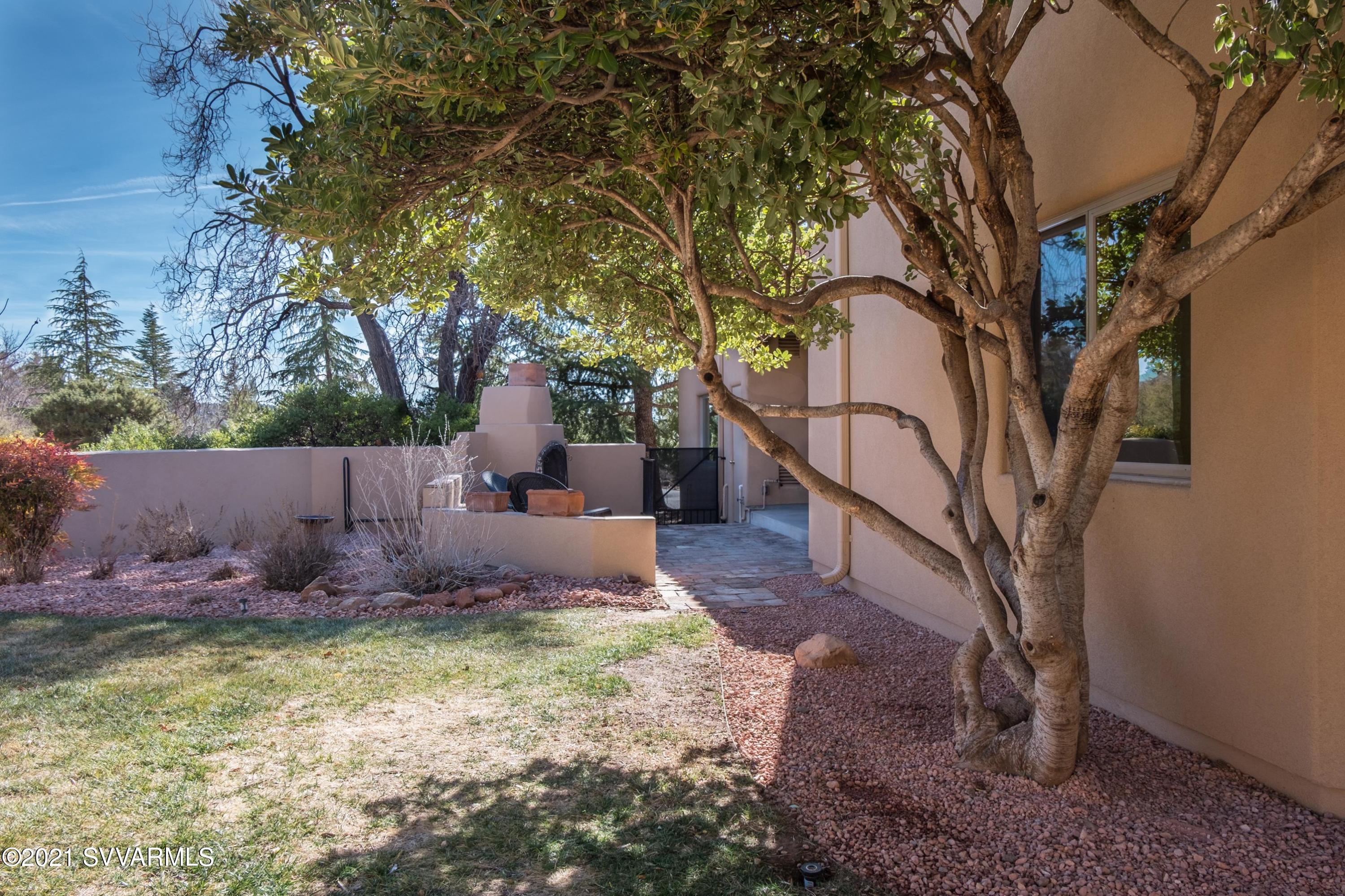 2430 Ranch Road Sedona, AZ 86336 - Photo 54 of 58 a backyard of a house with lots of green space