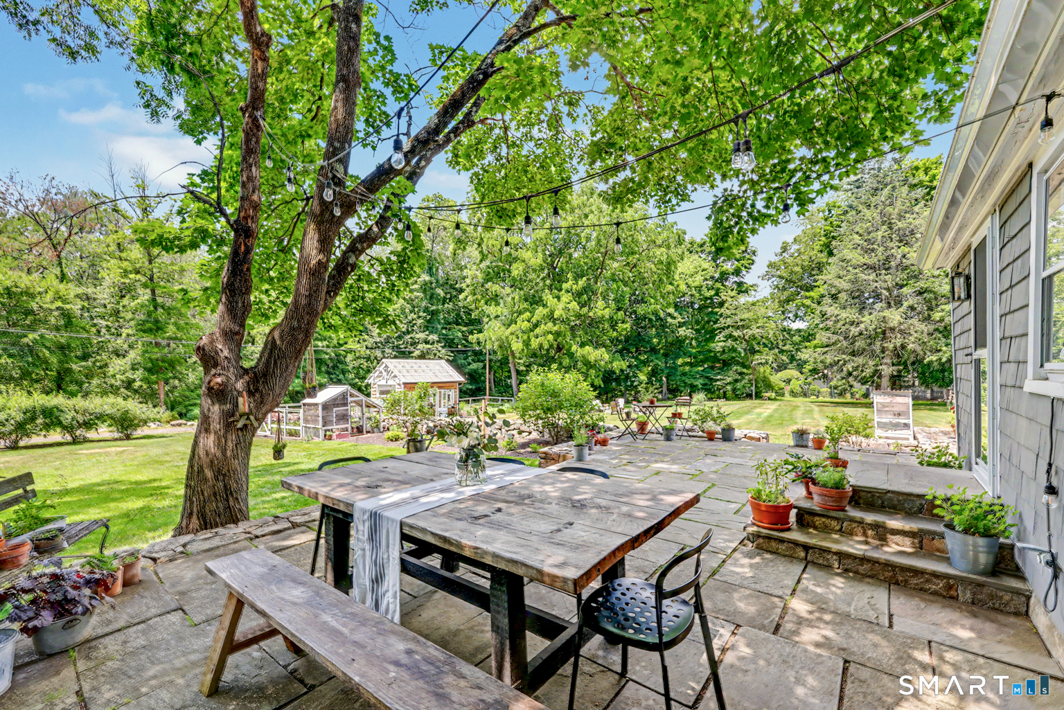 183 Range Road Wilton, CT 06897 - Photo 15 of 40 Large stone patio is great for outdoor dining