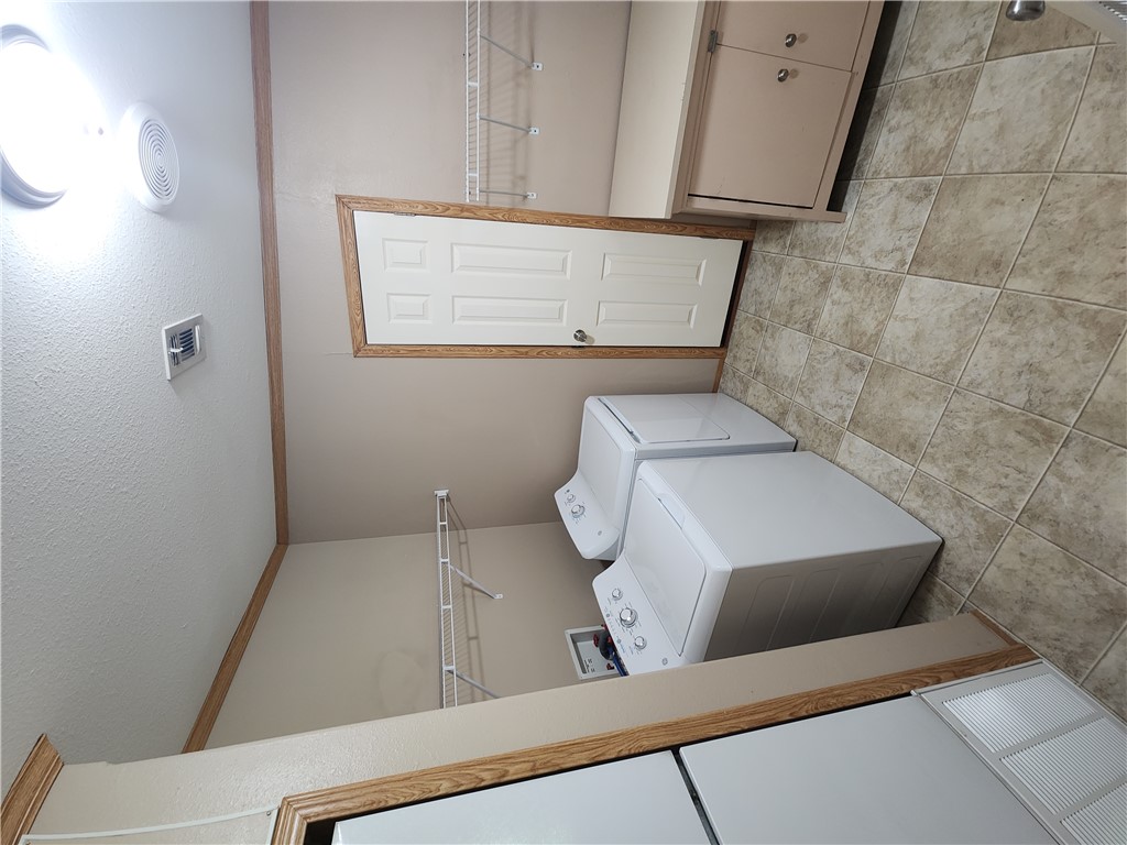 3738 Smetana Road Bryan, TX 77807 - Photo 9 of 29 a utility room with dryer and washer
