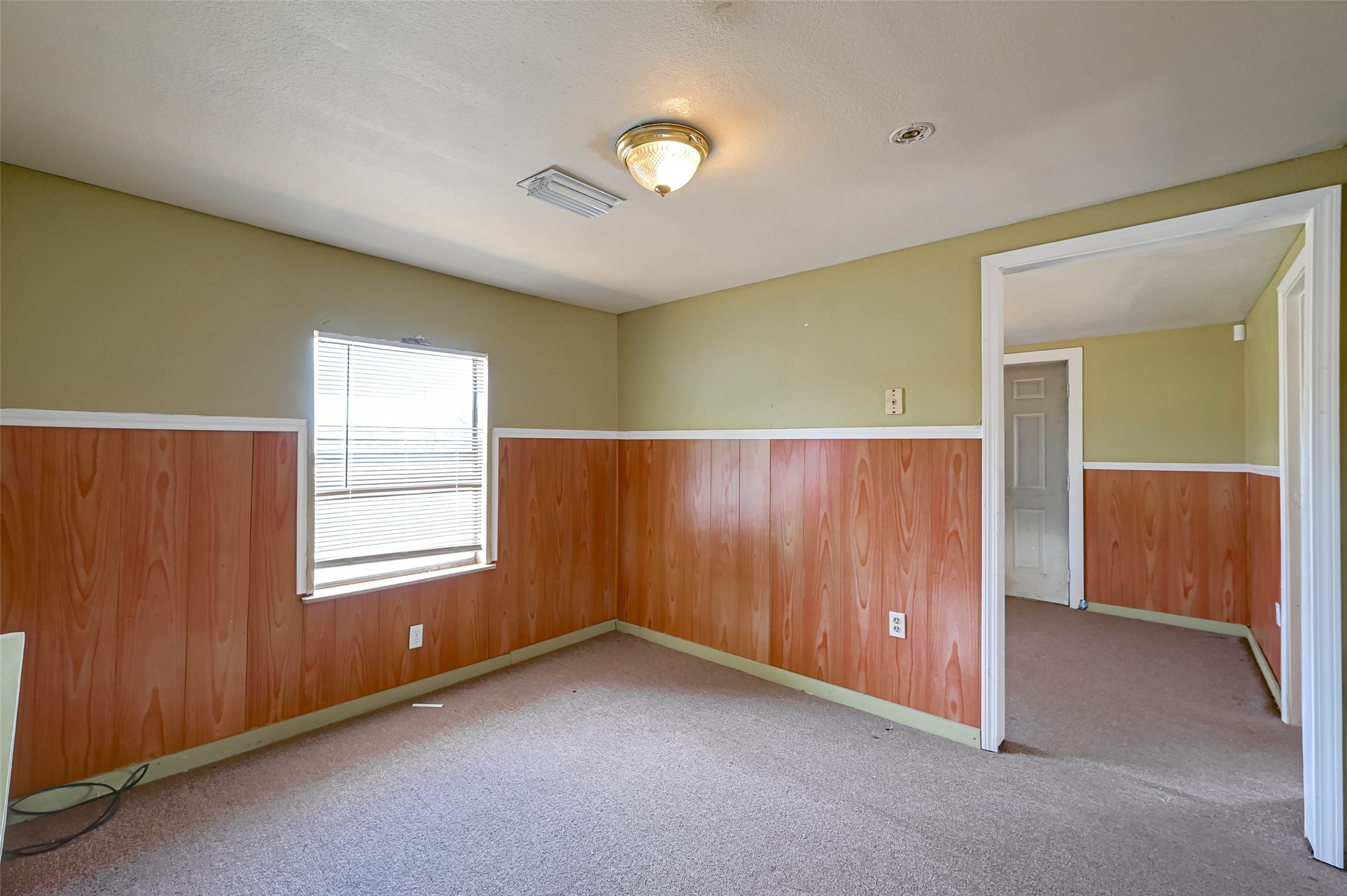 803 Mattie Street Wharton, TX 77488 - Photo 14 of 31 an empty room with windows and closet