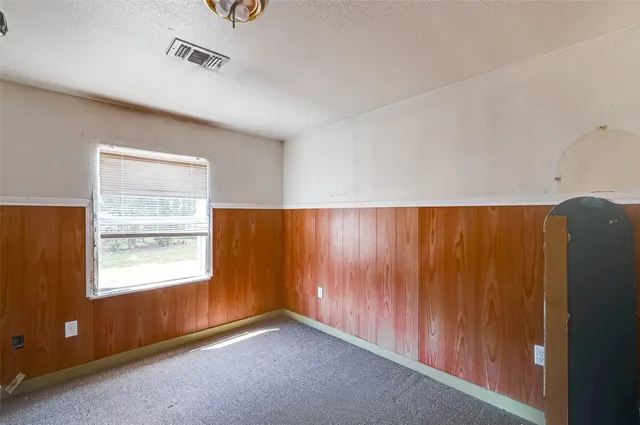 a bathroom with a bathtub and a window