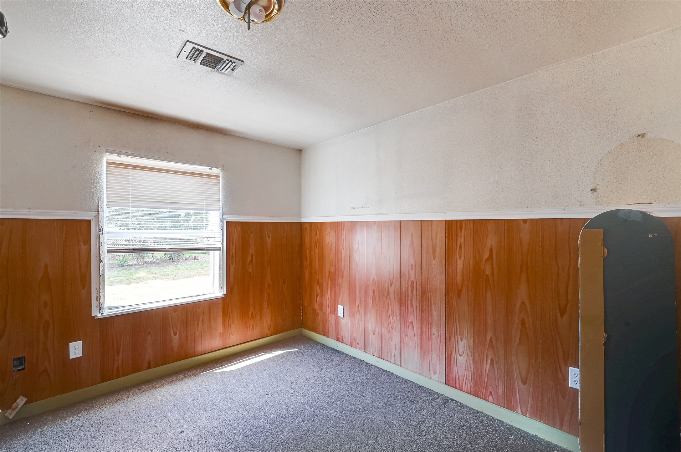 803 Mattie Street Wharton, TX 77488 - Photo 22 of 31 a view of an empty room and a window