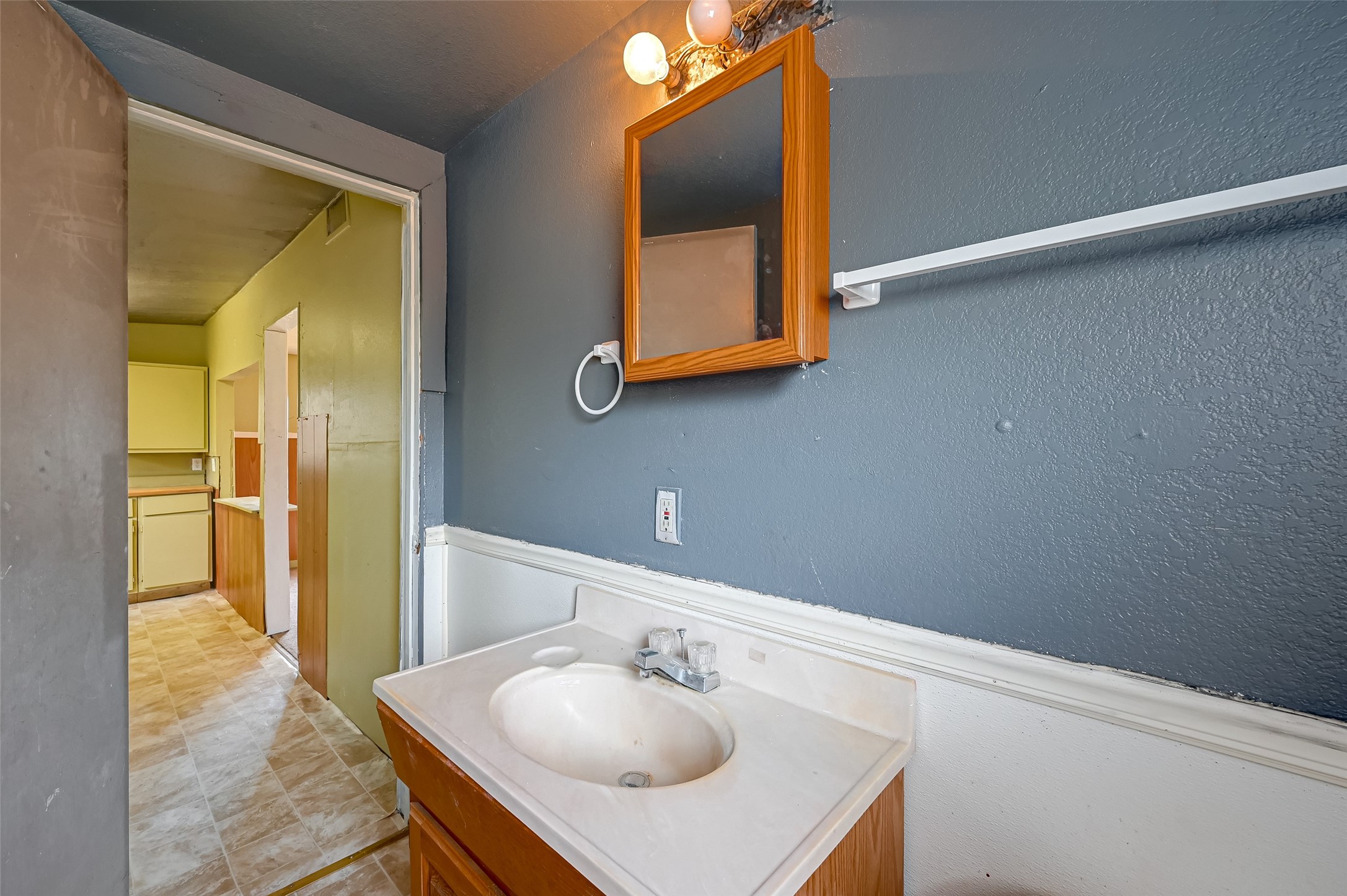 803 Mattie Street Wharton, TX 77488 - Photo 26 of 31 a bathroom with a sink and a mirror