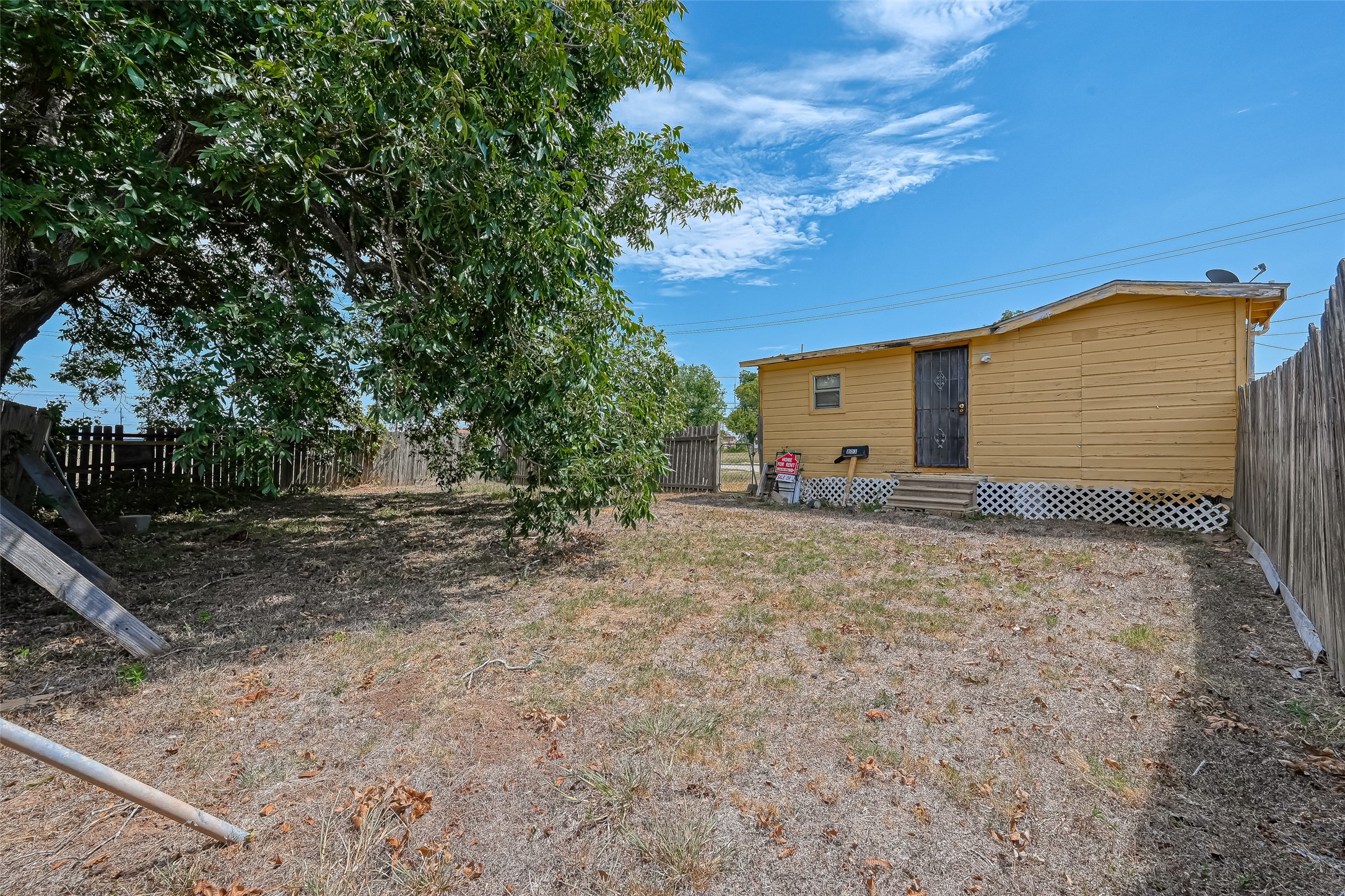 803 Mattie Street Wharton, TX 77488 - Photo 27 of 31 a backyard of a house with lots of green space