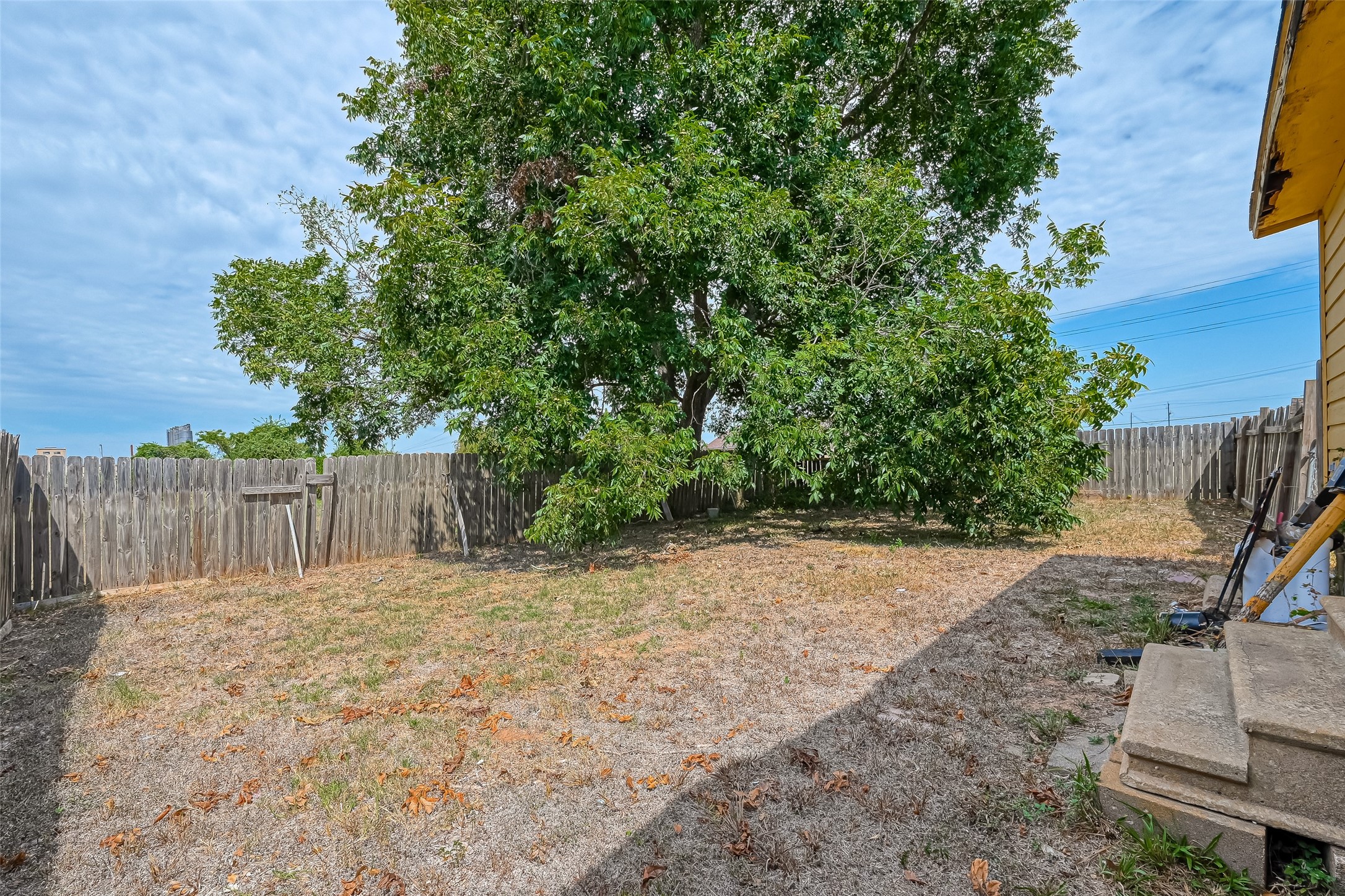 803 Mattie Street Wharton, TX 77488 - Photo 28 of 31 a street view with wooden fence