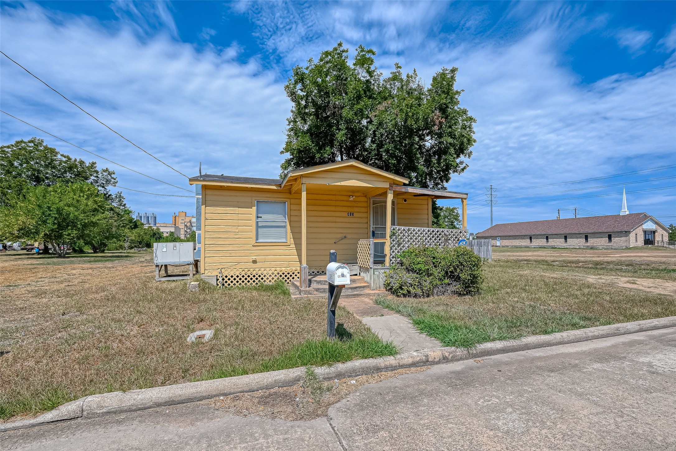 803 Mattie Street Wharton, TX 77488 - Photo 3 of 31 a front view of a house with a yard