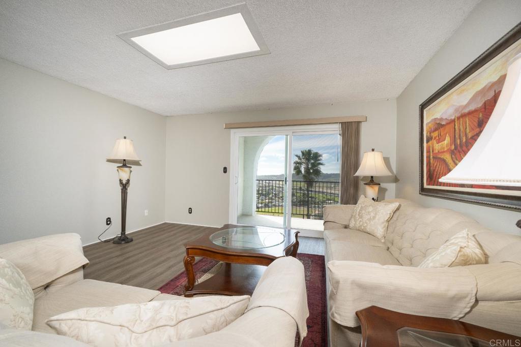 3606 Vista Rey, Unit 46 Oceanside, CA 92057 - Photo 17 of 32 a living room with furniture and a window
