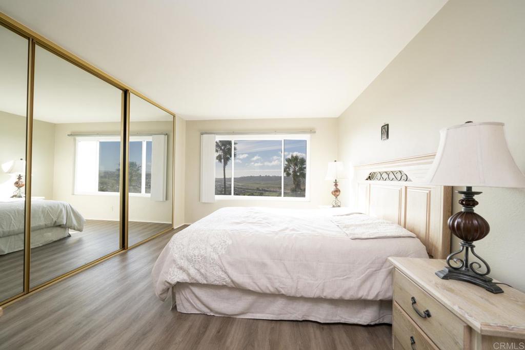 3606 Vista Rey, Unit 46 Oceanside, CA 92057 - Photo 20 of 32 a bedroom with a bed and a large window