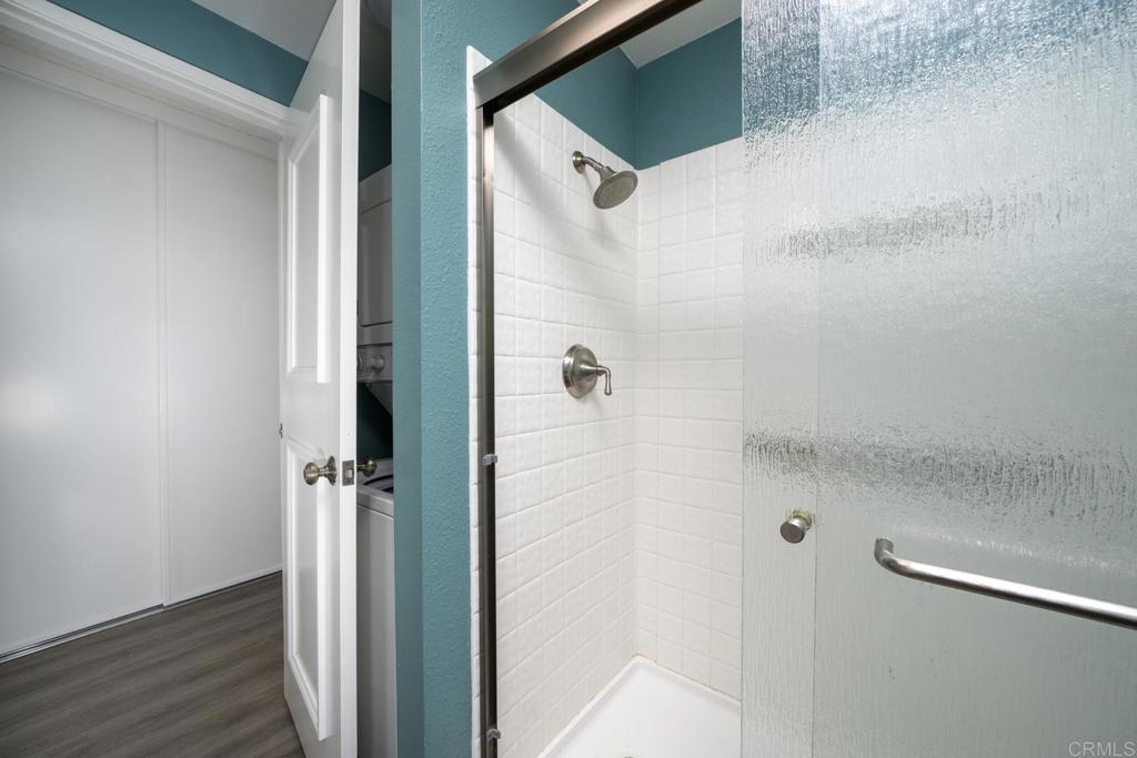 3606 Vista Rey, Unit 46 Oceanside, CA 92057 - Photo 25 of 32 a bathroom with a glass shower door
