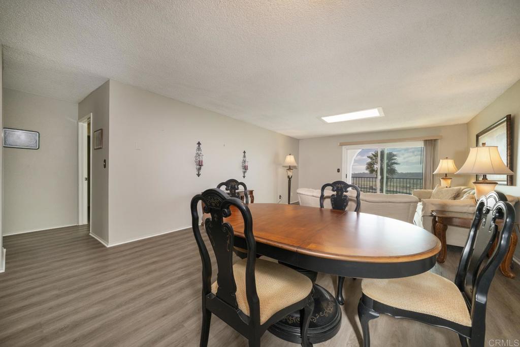 3606 Vista Rey, Unit 46 Oceanside, CA 92057 - Photo 8 of 32 a view of a dining room with furniture and wooden floor