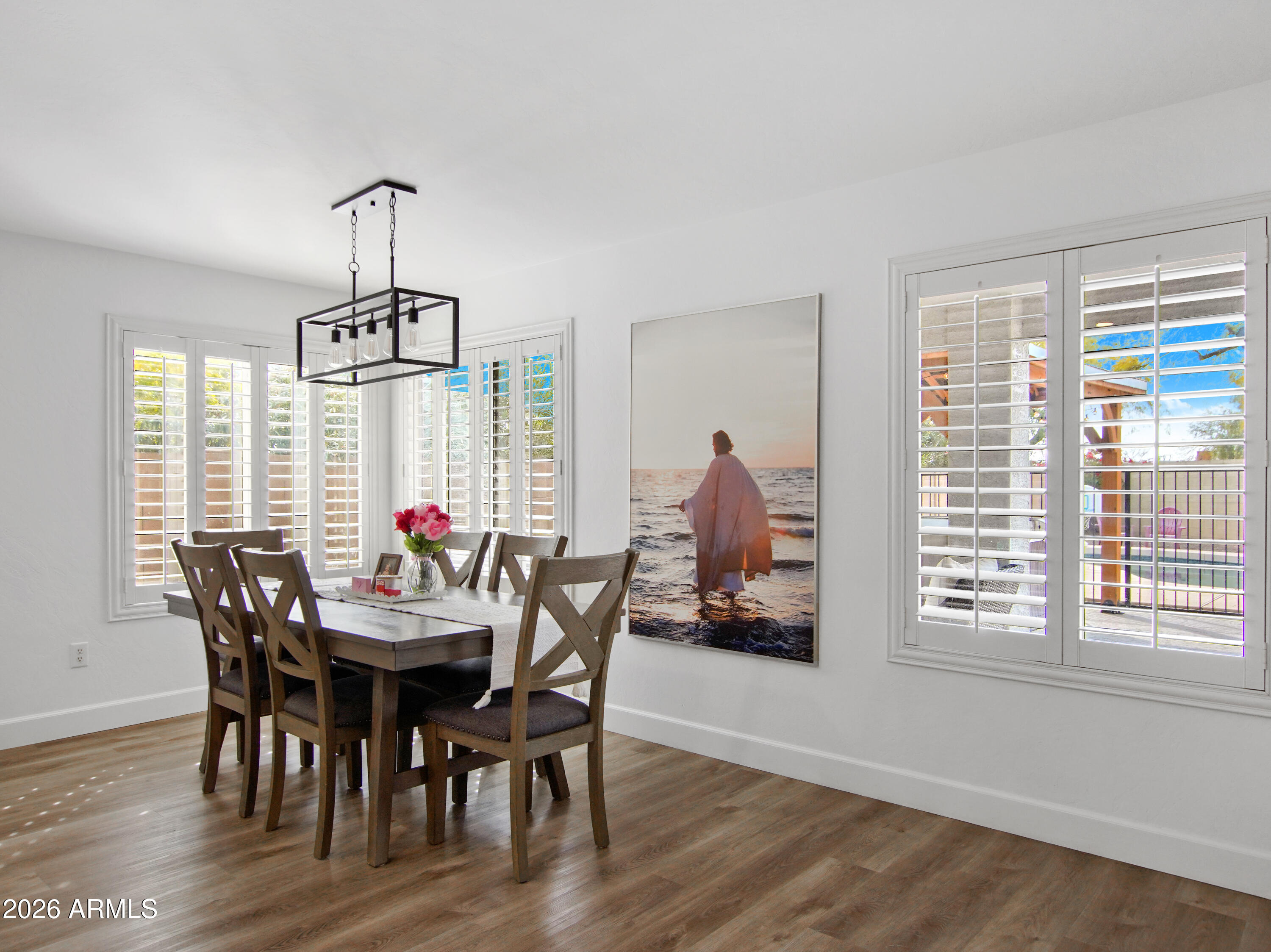 1960 South Portland Court Gilbert, AZ 85295 - Photo 16 of 53 a view of a dining room with furniture window and wooden floor