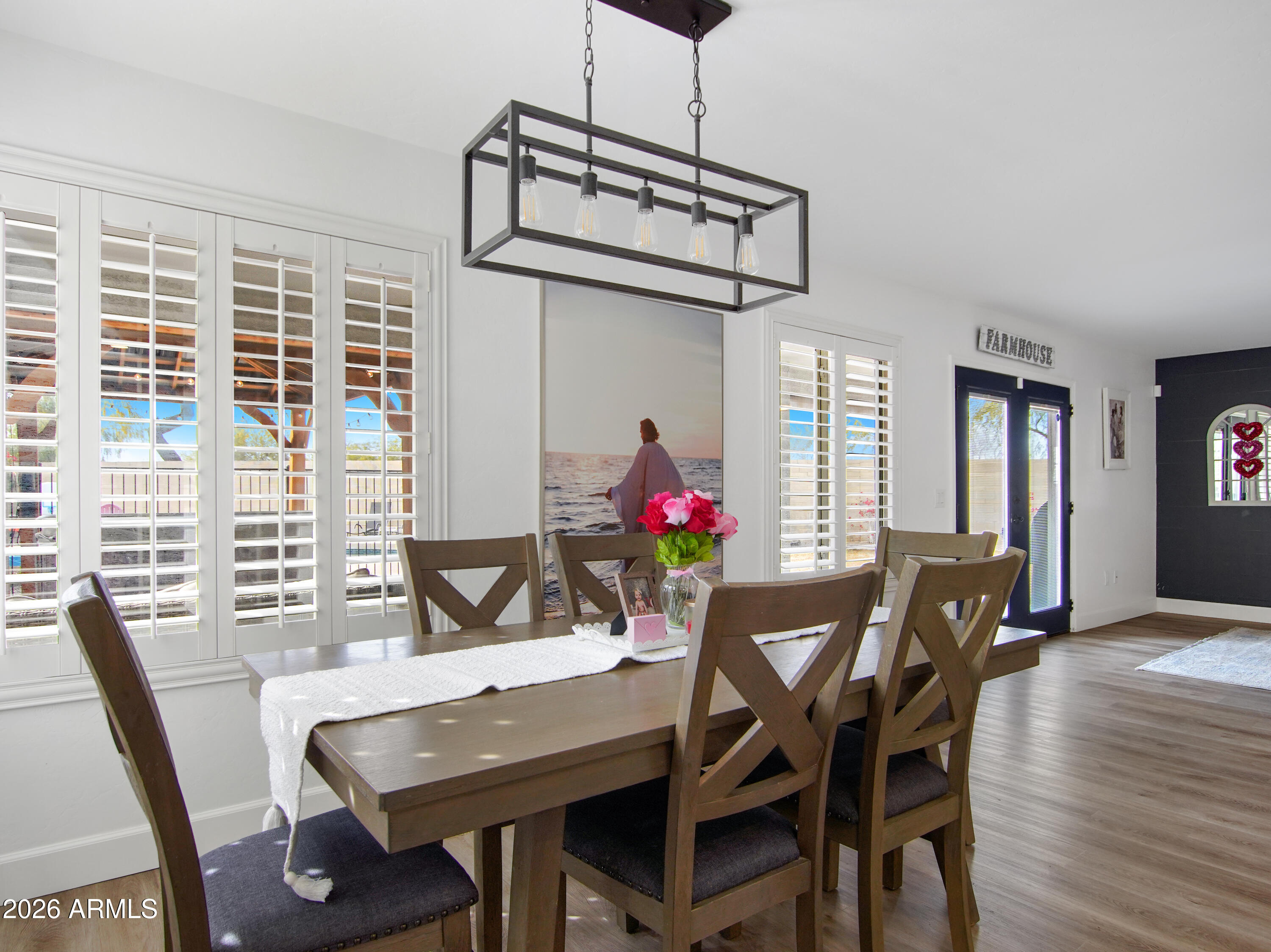 1960 South Portland Court Gilbert, AZ 85295 - Photo 17 of 53 a view of a dining room with furniture window and wooden floor