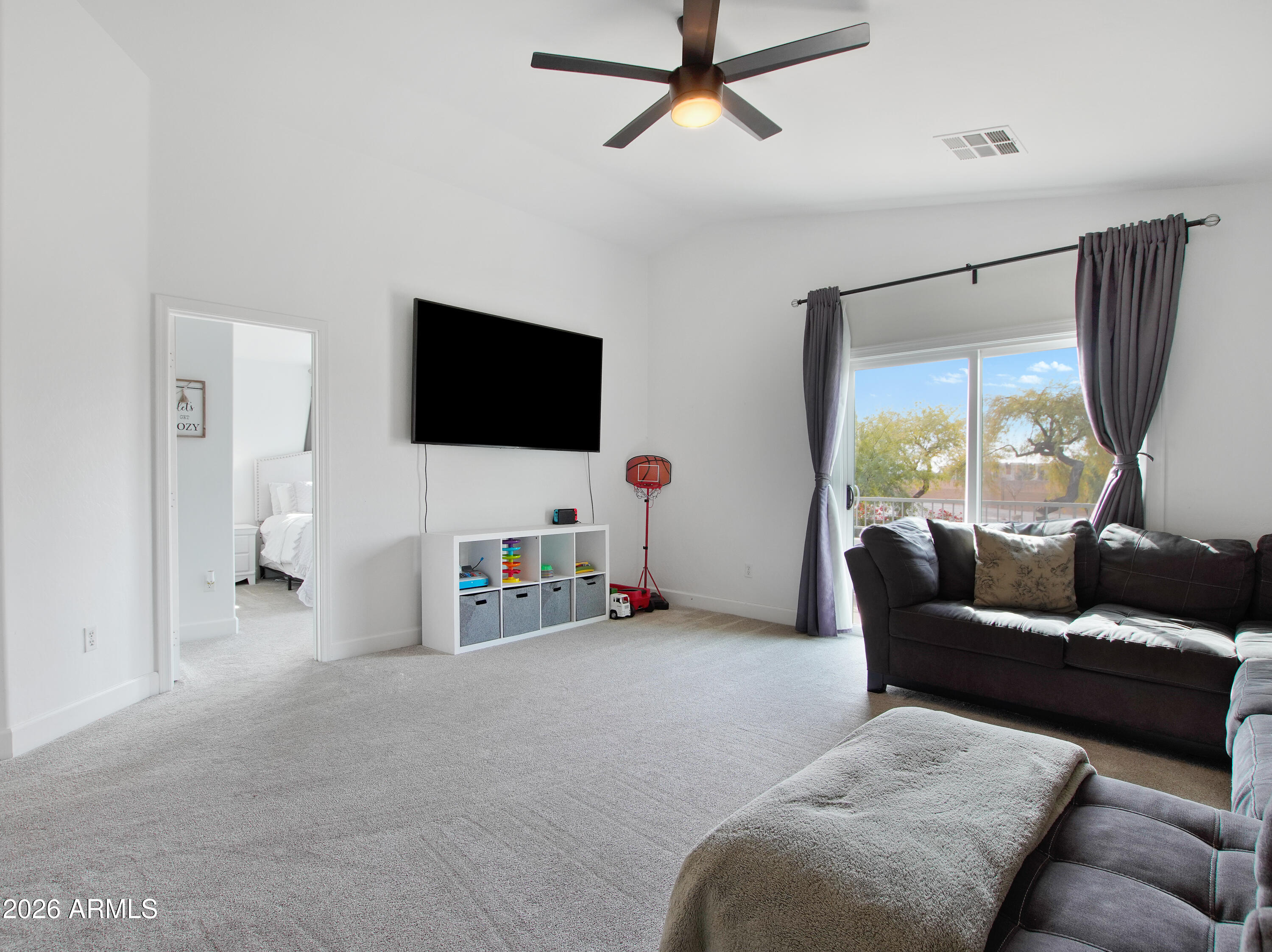 1960 South Portland Court Gilbert, AZ 85295 - Photo 25 of 53 a living room with furniture and a flat screen tv
