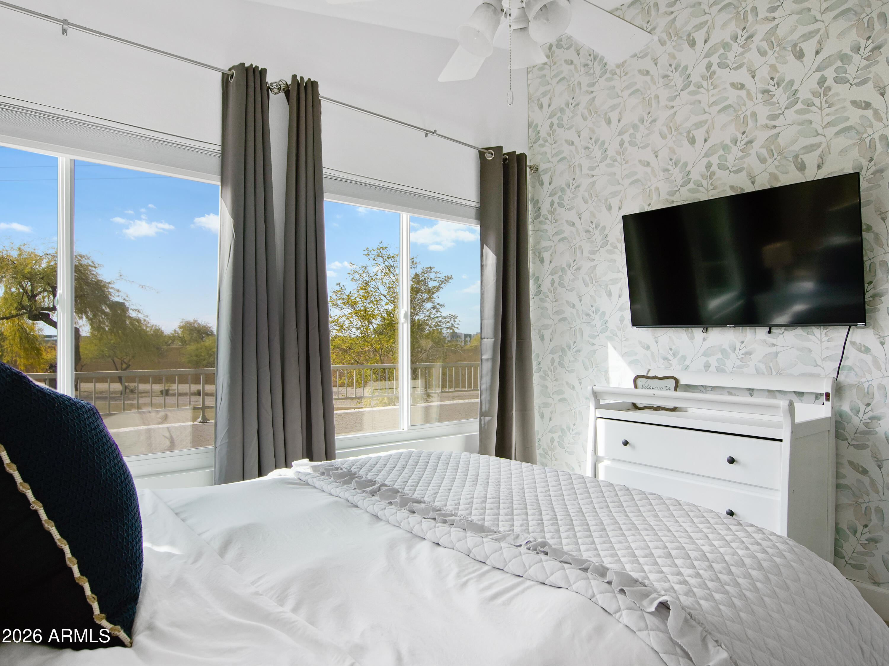 1960 South Portland Court Gilbert, AZ 85295 - Photo 26 of 53 a bedroom with a bed and a flat screen tv