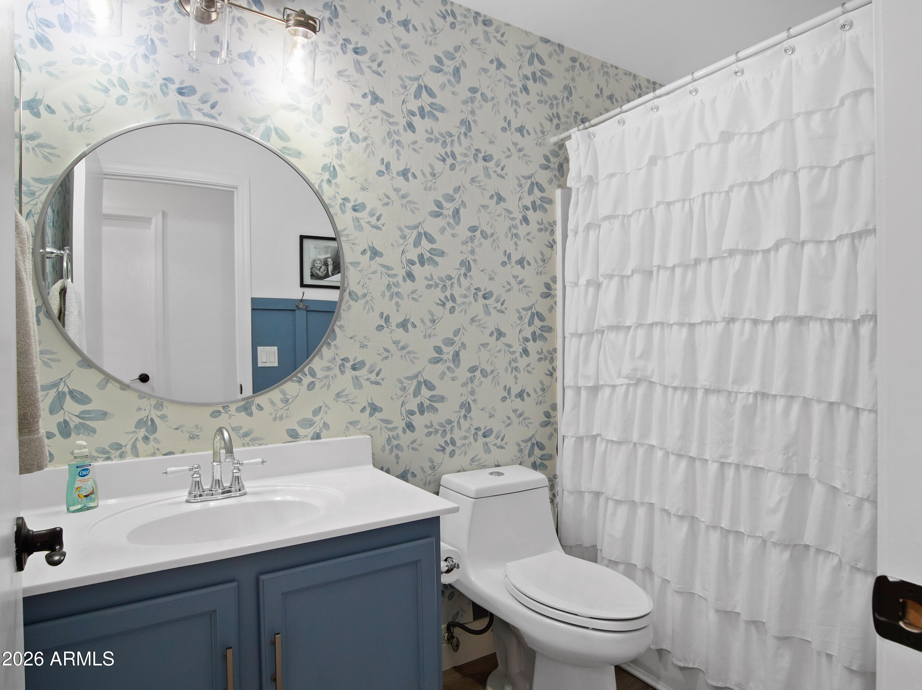 1960 South Portland Court Gilbert, AZ 85295 - Photo 28 of 53 a bathroom with a sink a toilet and mirror