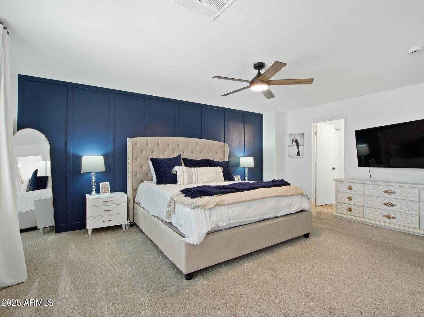 1960 South Portland Court Gilbert, AZ 85295 - Photo 31 of 53 a bedroom with bed tv and ceiling fan