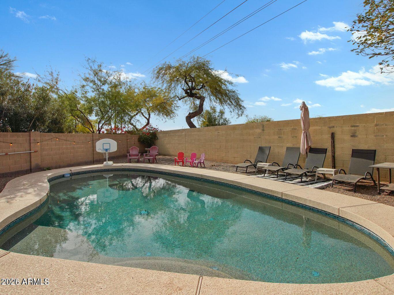 1960 South Portland Court Gilbert, AZ 85295 - Photo 44 of 53 a view of a swimming pool with a yard