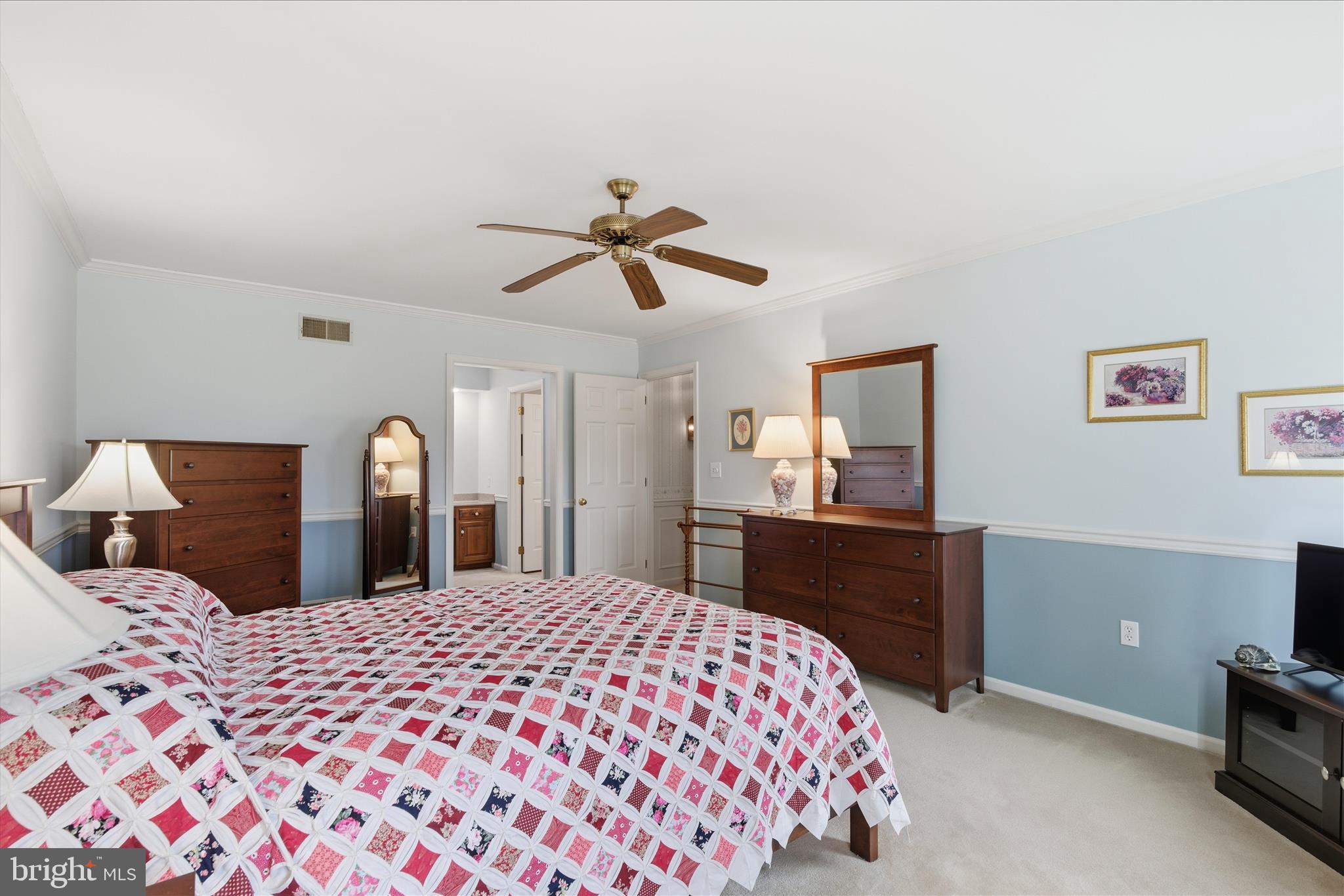546 Hi View Drive Lititz, PA 17543 - Photo 33 of 65 a bedroom with a large bed and a chandelier